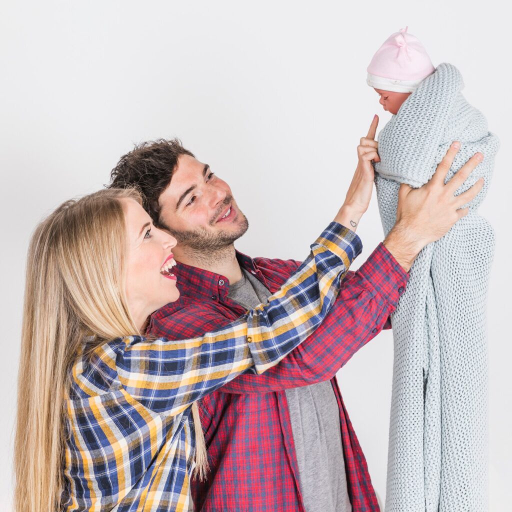 happy parents looking baby hands 23 2148101506